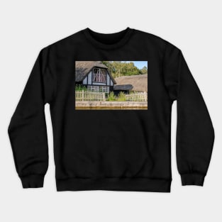 Traditional riverside cottage with thatched roof Crewneck Sweatshirt